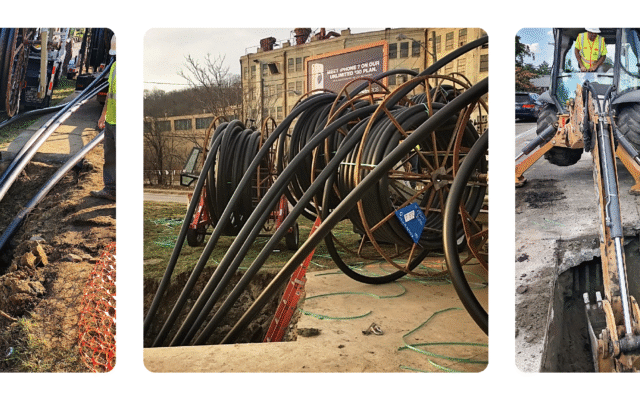 Construction workers installing underground utility cables.
